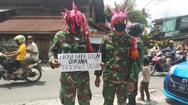 TNI bertopi virus corona. Foto: TNI/Koramil Samatiga