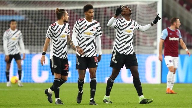 Pemain Manchester United Paul Pogba usai mencetak gol ke gawang West Ham United pada pertandingan lanjutan Premier League di Stadion London, London, Inggris. Foto: Julian Finney/REUTERS