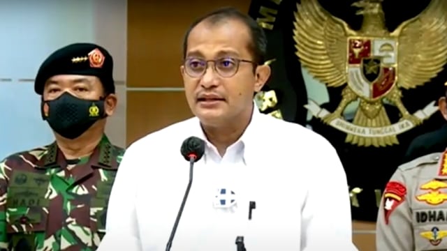 Wakil Menteri Hukum dan HAM, Edward Omar Sharif Hiariej, saat konferensi pers hentikan kegiatan FPI, Rabu (30/12). Foto: Youtube/Kompas TV