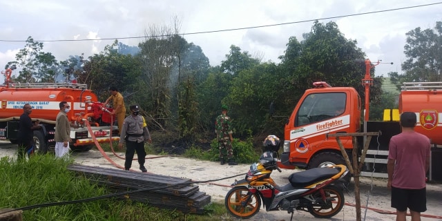 Serda Eko usai memadamkan api dilahan kosong. Foto: IST