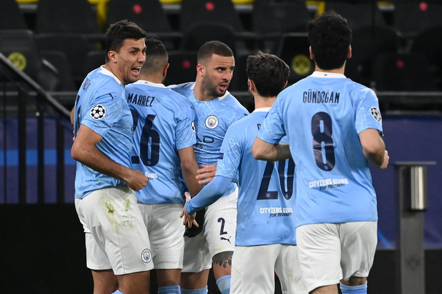 Selebrasi pemain Manchester City usai mencetak gol ke gawang Borussia Dortmund pada pertandingan leg kedua perempat final Liga Champions di Signal Iduna Park, Dortmund, Jerman. Foto: Ina Fassbender/Pool/REUTERS