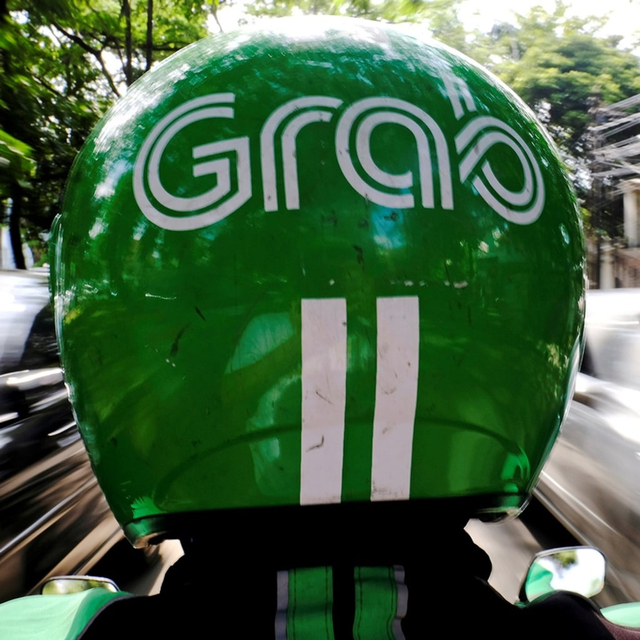 Layanan ojek online Grab. Foto: REUTERS/Beawiharta