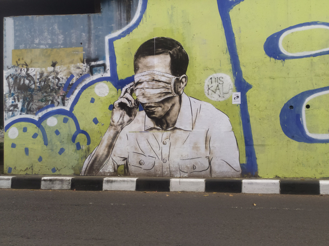 Sebuah mural mirip Presiden Joko Widodo di Flyover Pasupati Kota Bandung. Foto: Rachmadi Rasyad/kumparan