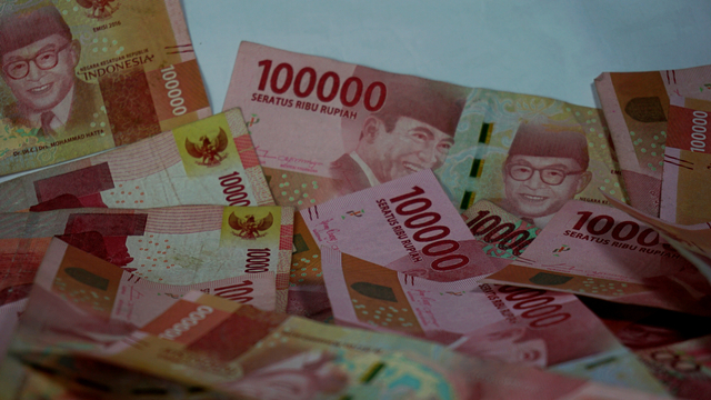 Ilustrasi uang. Foto: Shutter Stock