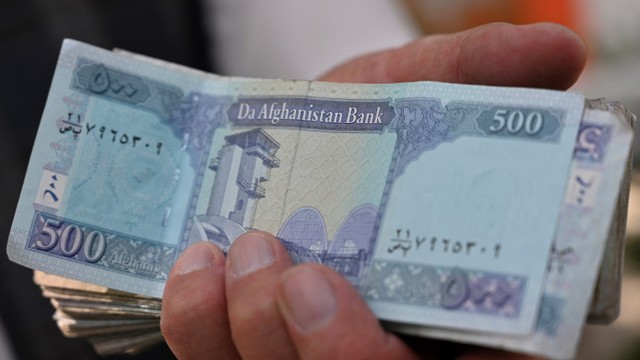 Ilustrasi foto mata uang Afghanistan, Afghani. Foto: ADEK BERRY / AFP