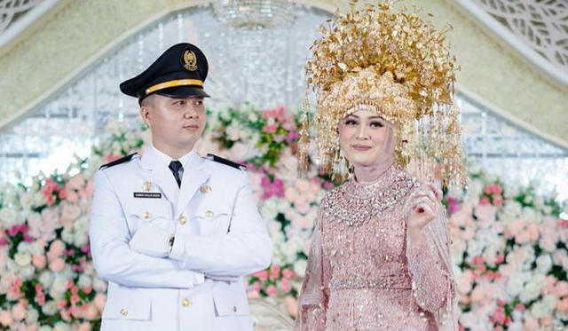 Pernikahan Polwan Suci dan ASN bernama Damsir. (ist)