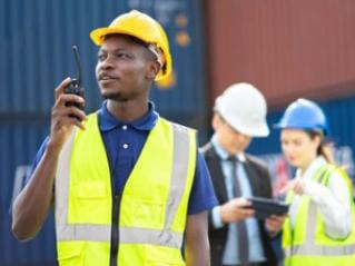 https://www.shutterstock.com/id/image-photo/smiling-builder-engineering-hardhat-walkie-talkie-1937940445