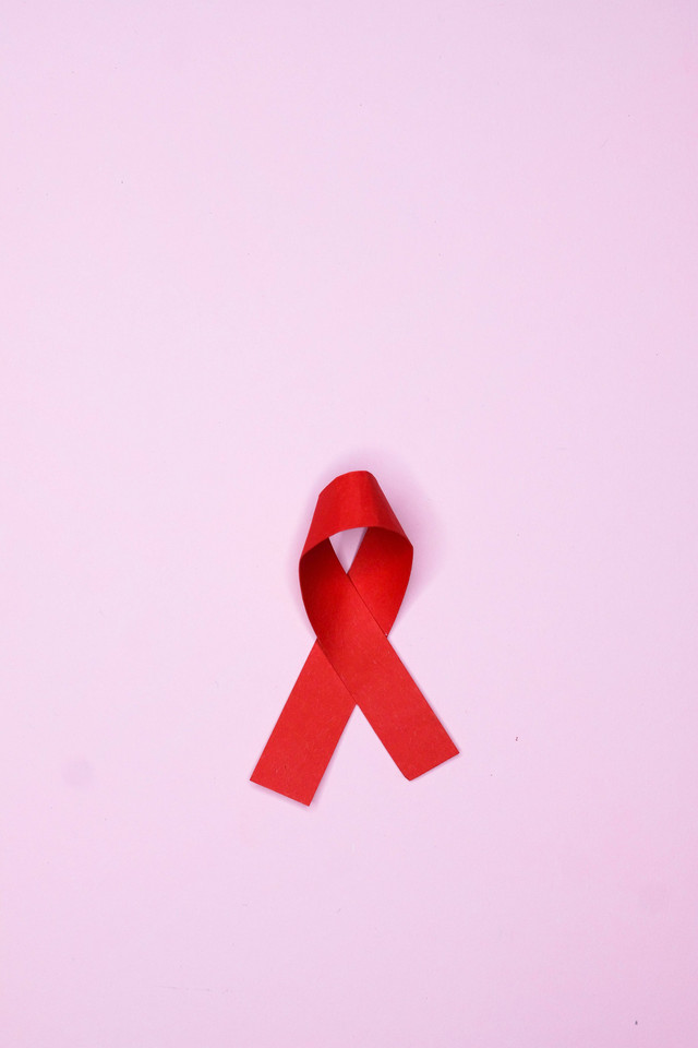https://www.pexels.com/photo/red-ribbon-on-pink-surface-8680265/