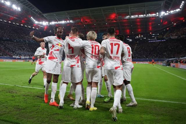 Selebrasi pemain RB Leipzig usai mencetak gol ke gawang Real Madrid pada pertandingan Grup F Liga Champions di Red Bull Arena, Leipzig, Jerman. Foto: Ronny HARTMANN / AFP