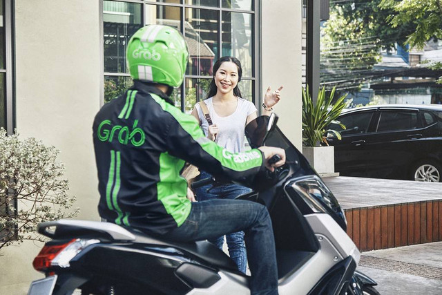 Ilustrasi driver Grab dan konsumen. Foto: Grab Indonesia