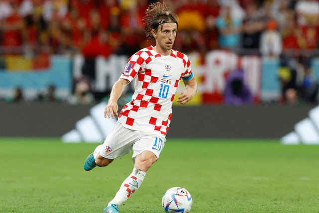 Pemain Kroasia Luka Modric beraksi saat melawan Belgia pada Piala Dunia FIFA Qatar 2022 di Stadion Ahmad Bin Ali, Al Rayyan, Qatar, Kamis (1/12/2022). Foto: Piroschka Van De Wouw/REUTERS