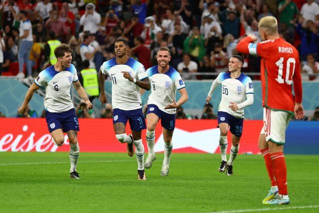 Selebrasi pemain Timnas Inggris Marcus Rashford usai mencetak gol ke gawang Timnas Wales pada pertandingan Grup B Piala Dunia 2022 Qatar di Stadion Ahmad Bin Ali, Al Rayyan, Qatar.Foto: Hannah McKay/REUTERS