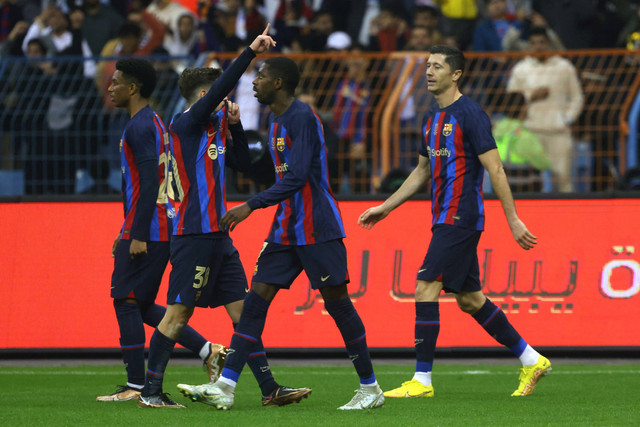  Selebrasi pemain FC Barcelona usak mencetak gol ke gawang Real Madrid pada pertandingan Piala Piala Super Spanyol di Stadion Internasional King Fahd di Riyadh, Arab Saudi. Foto: Fayez NURELDINE / AFP