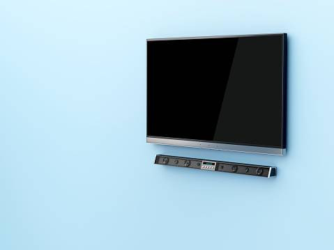 Ilustrasi menggunakan soundbar di bawah TV. Foto: Unsplash.com