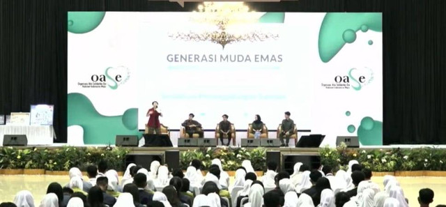 Kegiatan "Generasi Muda Emas, Bebas Narkoba, dan Peduli Lingkungan" yang digelar di gedung Bagas Raya, Bandar Lampung dan dihadiri Ibu Negara Iriana Joko Widodo beserta rombongan OASE KIM. | Foto : Tangkapan layar YouTube/Oase Kabinet Indonesia Maju
