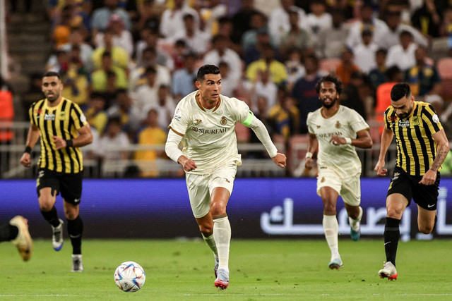 Cristiano Ronaldo beraksi selama pertandingan Al-Ittihad Al-Nassr dalam lanjutan Liga Pro Arab Saudi di Stadion King Abdullah Sport City, Jeddah, pada 9 Maret 2023. Foto: AFP