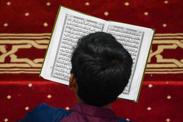 Ilustrasi Al'Quran, kitab suci umat Islam: Bay Ismoyo/AFP