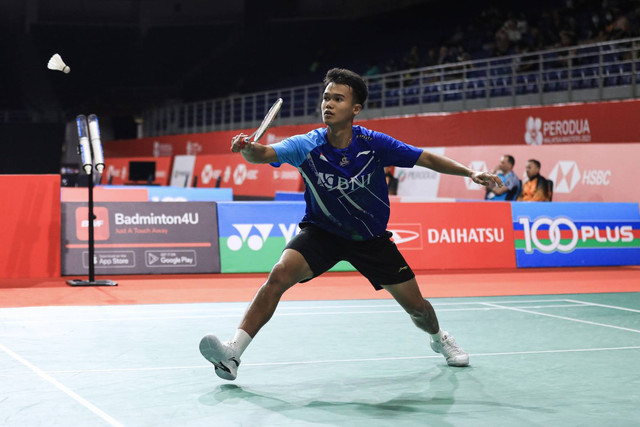 Pebulu tangkis Indonesia, Christian Adinata, beraksi di babak kualifikasi Malaysia Masters 2023 di Axiata Arena, Kuala Lumpur, Malaysia, Selasa (23/5). Foto: Dok. PBSI