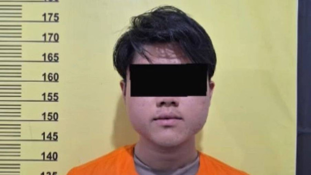 Pria di Bengkalis yang pasang bendera Merah Putih di leher anjing ditetapkan sebagai tersangka. Foto: Dok. Istimewa