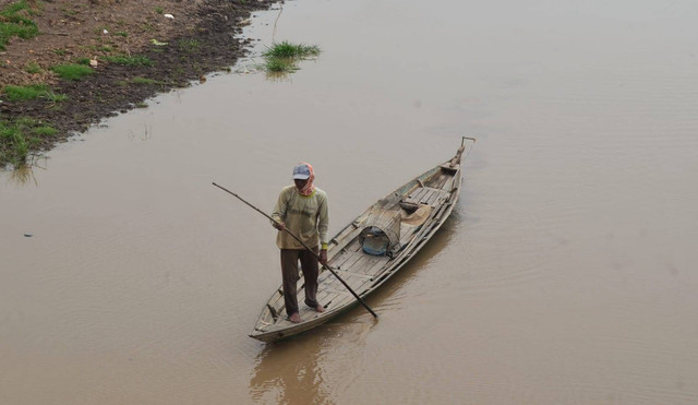 Ilustari masyarakat Melayu yang mencari ikan menggunakan perahu/ Photo Image By Mahesa Putra