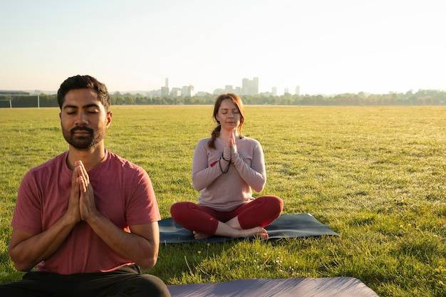 sumber foto: https://img.freepik.com/free-photo/front-view-man-woman-meditating-outdoors-yogamats_232148988393.jpgt=st=1724576711~exp=1724580311~hmac=8ac5e1f3abfec72f571f029f938b3c33e7b79e8301619deea29cf7fc29902e7&w=900