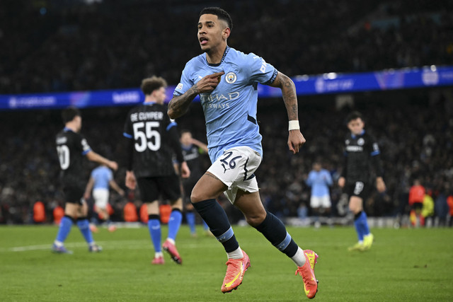 Pemain Manchester City Savinho berselebrasi usai mencetak gol. Foto: Paul Ellis/AFP