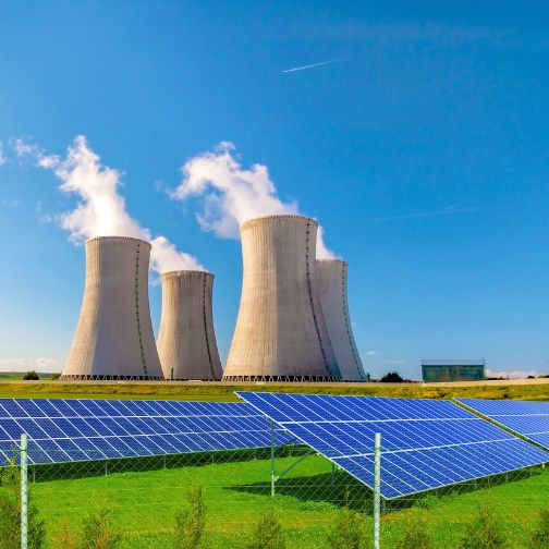 Sumber Gambar: Canva Pro "Nuclear power plant with energy solar panels" by MartinLisner
