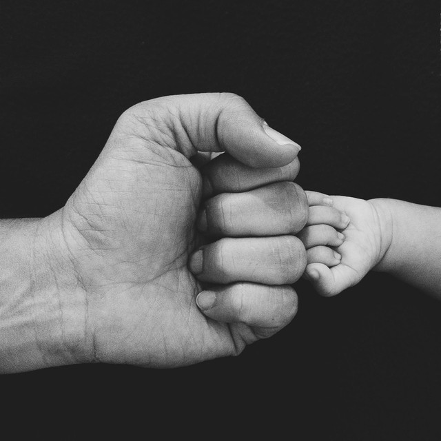 Photo by Abhi Nikam: https://www.pexels.com/photo/grayscale-photo-a-baby-and-a-person-doing-a-fist-bump-7060508/