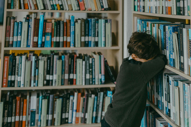 Photo by Mikhail Nilov from Pexels: https://www.pexels.com/photo/a-boy-crying-beside-the-bookcase-7929246/