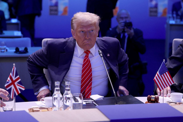 Presiden Amerika Serikat Donald Trump menghadiri pertemuan puncak NATO di Den Haag, Belanda, Rabu (25/6/2025). Foto: Toby Melville/REUTERS