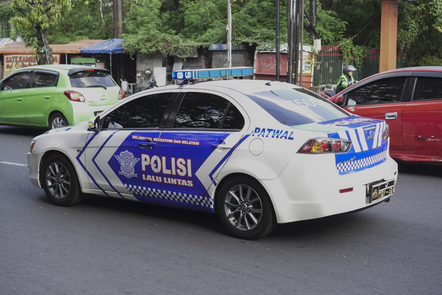 Ilustrasi Mobil Polisi. Foto: Rizky Ade Jonathan/Shutterstock
