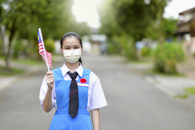 Ilustrasi siswa di Malaysia menggunakan masker agar terhindari dari influenza. Foto: Shutterstock