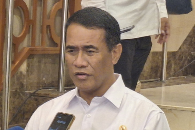 Menteri Pertanian Andi Amran Sulaiman usai acara Town Hall 1 Tahun Kinerja Kemenko Pangan di Grha Mandiri, Jakarta Pusat, Selasa (21/10/2025). Foto: Argya D. Maheswara/kumparan 