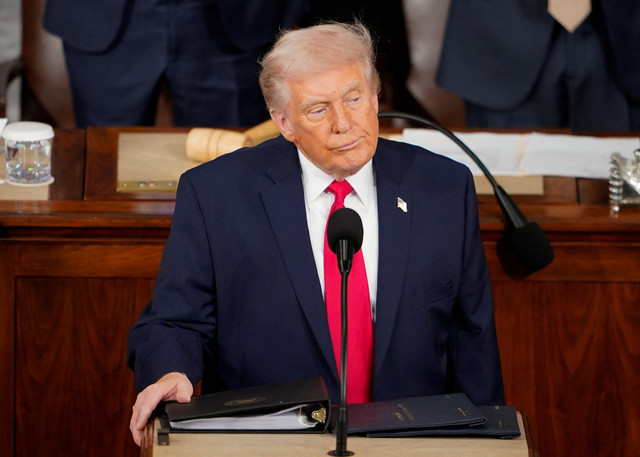 Presiden AS Donald Trump menyampaikan pidato kenegaraan di Gedung Capitol AS di Washington DC. Foto: Nathan Howard/REUTERS