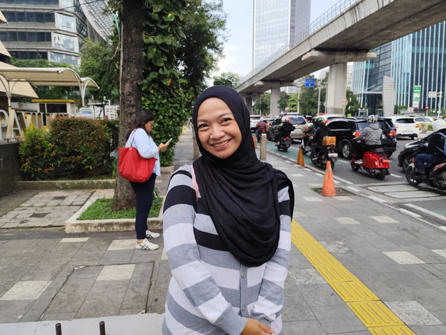 Gismi (30), pengguna layanan ojol di Jakarta. Foto: Nauval Pratama/kumparan