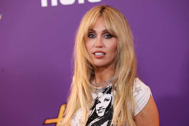 Miley Cyrus menghadiri pemutaran perdana dunia acara televisi "Hannah Montana 20th Anniversary Special" di Los Angeles, California, AS, Selasa (23/3/2026). Foto: Mario Anzuoni/REUTERS