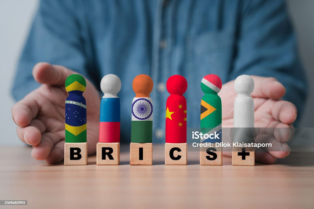 Sumber: https://www.istockphoto.com/en/photo/brazil-russia-india-china-south-africa-and-white-flag-print-screen-on-wooden-figure-gm2169682993-589656614