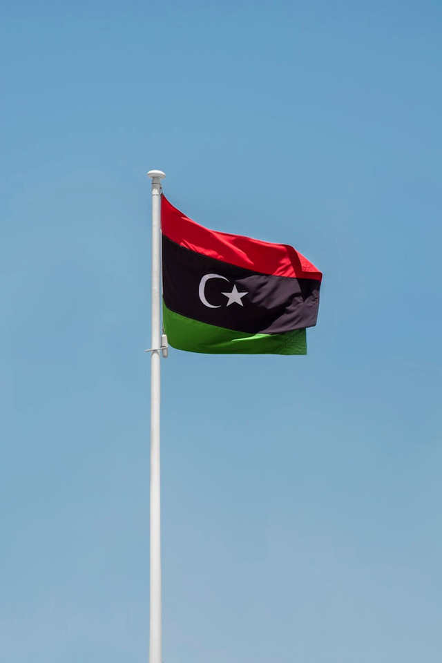 Ilustrasi bendera Libya. Foto: Aboodi Vesakaran/Unsplash