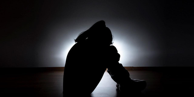 https://www.pexels.com/photo/depressed-woman-sitting-in-room-corner-7776352/