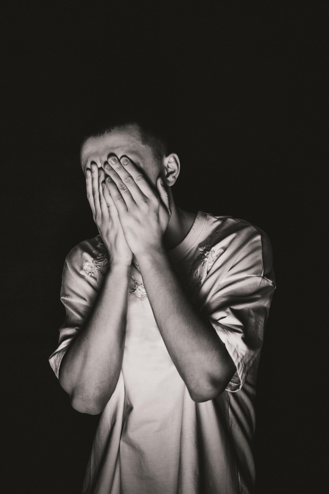 Photo by Wojtek Pacześ from Pexels: https://www.pexels.com/photo/grayscale-photo-of-a-man-covering-his-face-6224814/ 