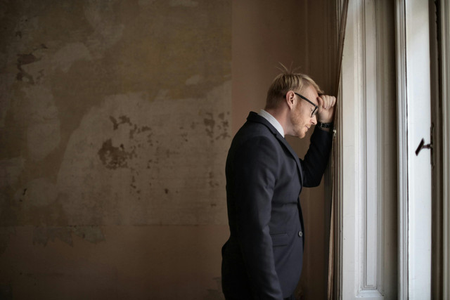 https://www.pexels.com/photo/desperate-evicted-male-entrepreneur-standing-near-window-3771129/