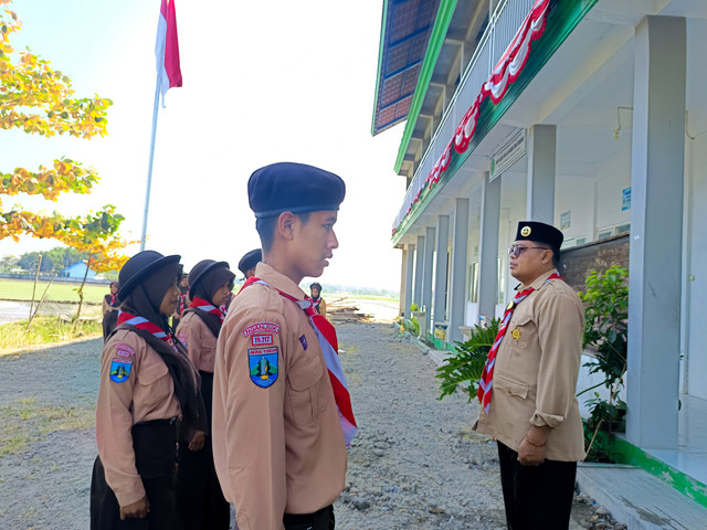 Upacara Peringatan Hari Pramuka ke-65 tahun 2026 di Pangkalan SMP Islam Plus An Nahdliyah Gobang. Dokumen SMP Islam Plus An Nahdliyah Gobang.