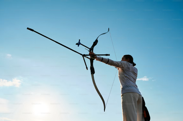 https://unsplash.com/photos/a-woman-is-holding-a-bow-and-arrow-0An8IhI9AP8