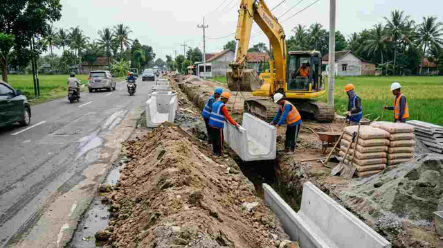 foto ilustrasi gambar proyek drainase jalan aspal. sumber: generate ai