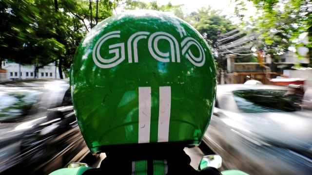 Perusahaan transportasi online Grab. Foto: Beawiharta/Reuters