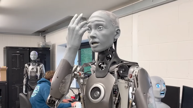 Robot humanoid Ameca takjub lihat tangannya sendiri. Foto: Engineered Arts