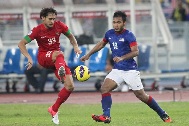 Eks pemain Timnas Malaysia Safee Sali saat melawan Timnas Indonesia. Foto: MOHD RASFAN / AFP