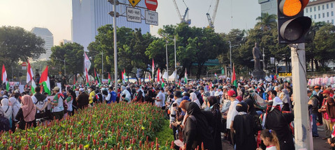 Aksi penolakan keikutsertaan Israel dalam ajang Olimpiade Paris yang digelar di Patung Kuda, Jakarta Pusat, pada Minggu (21/7). Foto: Rachmadi Rasyad/kumparan