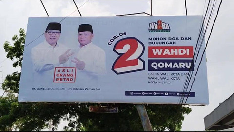Flayer pasangan calon Walikota dan wakil Walikota Metro, Wahdi dan Qomaru Zaman. | Foto: Dok Istimewa