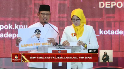 Paslon nomor urut 01 Imam Budi Hartono dan Ririn Farabi Arafiq mengikuti Debat Pilwalkot Depok 2024 di Depok, Kamis (21/11/2024). Foto: Youtube/KPU KOTA DEPOK